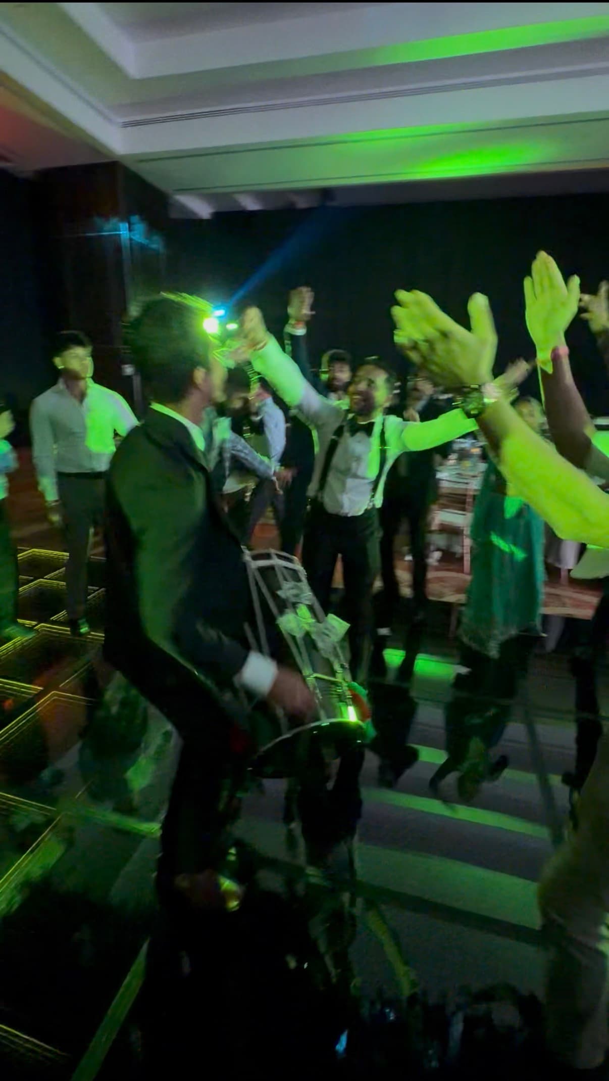 Energetic dhol set with the crowd cheering at a wedding