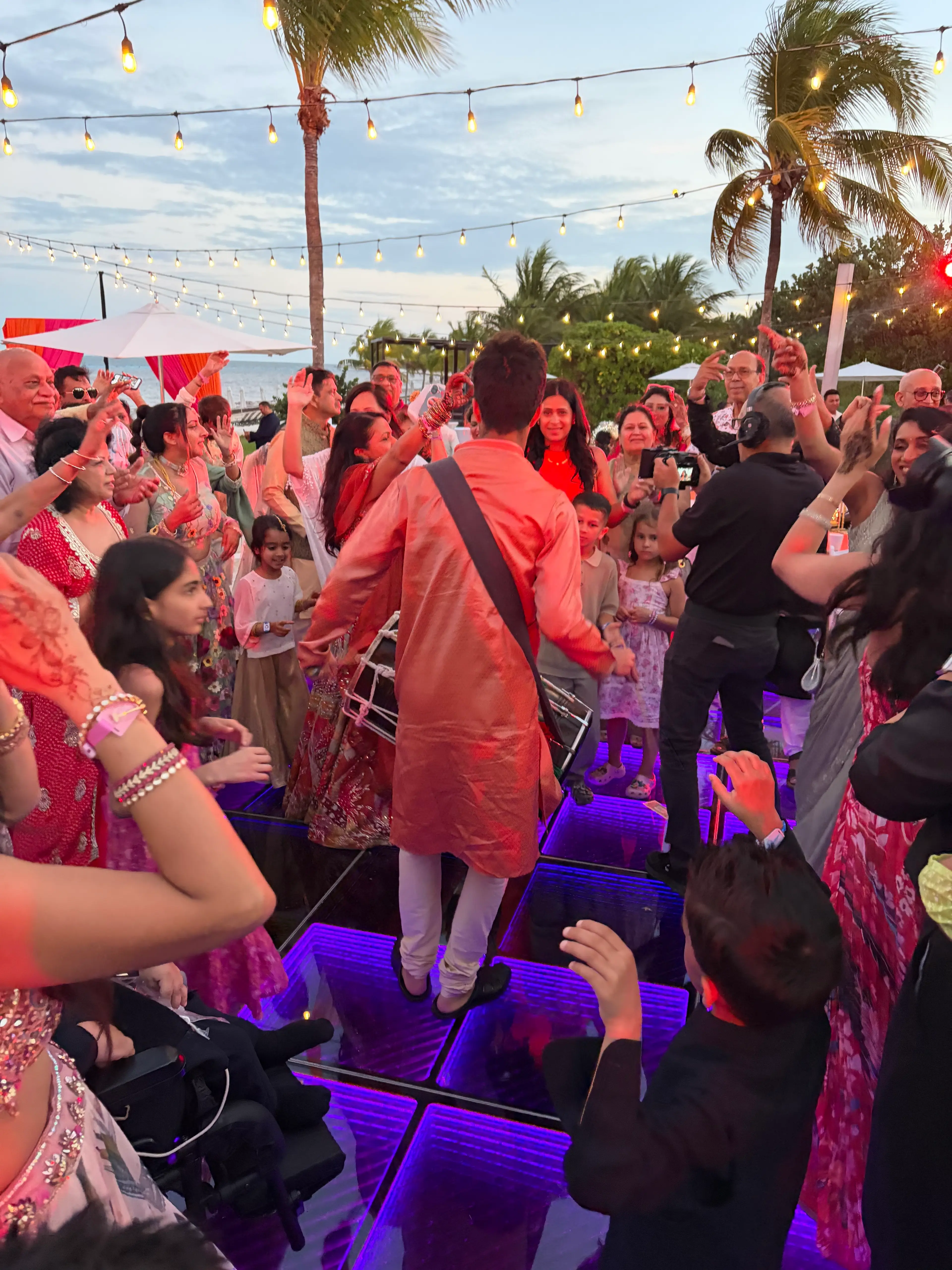 Ajisth performing dhol at a wedding entrance